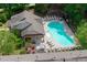 Overhead view of community pool with ample seating, pool house, and landscaping at 2122 Pembroke Dr, Brookhaven, GA 30319