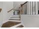 Elegant staircase featuring wood treads and white risers, seamlessly connecting different levels of the home with style at 2122 Pembroke Dr, Brookhaven, GA 30319