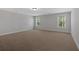 A simple bedroom with neutral walls and two windows at 4720 Cooling Water Sw Cir, Powder Springs, GA 30127