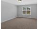 A simple bedroom with neutral walls and one window at 4720 Cooling Water Sw Cir, Powder Springs, GA 30127