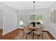 Bright dining area with hardwood floors, natural light and seating for four at 4720 Cooling Water Sw Cir, Powder Springs, GA 30127