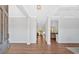 Bright foyer with hardwood floors, white trim, and coffered ceilings offering a glimpse into the home's open layout at 4720 Cooling Water Sw Cir, Powder Springs, GA 30127
