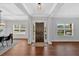 Entryway showcasing hardwood floors, a dark wood door, and large windows providing ample natural light at 4720 Cooling Water Sw Cir, Powder Springs, GA 30127