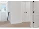 Upstairs hallway with carpeted floors and large storage closet at 4720 Cooling Water Sw Cir, Powder Springs, GA 30127