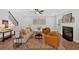 Cozy living room with fireplace, hardwood floors and comfortable seating at 4720 Cooling Water Sw Cir, Powder Springs, GA 30127