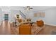 Cozy living room with stylish seating, decorative art, and hardwood floors, perfect for relaxing or entertaining guests at 4720 Cooling Water Sw Cir, Powder Springs, GA 30127