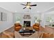 Inviting living room with a fireplace, comfortable seating, and hardwood floors at 4720 Cooling Water Sw Cir, Powder Springs, GA 30127