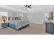 A spacious main bedroom with a tray ceiling and large windows for natural light at 4720 Cooling Water Sw Cir, Powder Springs, GA 30127
