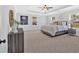 Spacious main bedroom boasts tray ceiling, ceiling fan, and abundant natural light at 4720 Cooling Water Sw Cir, Powder Springs, GA 30127