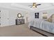 The main bedroom features ample space, neutral decor, and a tray ceiling at 4720 Cooling Water Sw Cir, Powder Springs, GA 30127