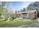 Expansive backyard featuring a patio, fire pit, and green lawn, perfect for outdoor relaxation and activities at 5925 Old Bill Cook Rd, South Fulton, GA 30349
