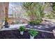 Landscaped backyard with patio, black mulch, and vibrant flowers, creating a serene outdoor space at 5925 Old Bill Cook Rd, South Fulton, GA 30349