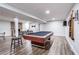Finished basement featuring a pool table, lounge area, and sleek lighting at 5925 Old Bill Cook Rd, South Fulton, GA 30349