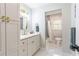 Bright bathroom with an updated vanity with gold hardware and an attached tub/shower at 5925 Old Bill Cook Rd, South Fulton, GA 30349