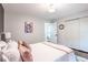 Bright bedroom with art, a closet, and an attached bathroom at 5925 Old Bill Cook Rd, South Fulton, GA 30349