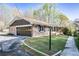 Charming brick home featuring an attached garage, inviting curb appeal, and lush landscaping at 5925 Old Bill Cook Rd, South Fulton, GA 30349