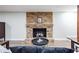 Finished basement featuring a decorative fireplace and lounge area at 5925 Old Bill Cook Rd, South Fulton, GA 30349
