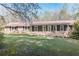 Charming one story brick home featuring a well-maintained lawn, updated exterior paint, and a cozy front porch at 5925 Old Bill Cook Rd, South Fulton, GA 30349