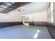 Well-maintained garage with gray epoxy floor, storage cabinets, and modern decor at 5925 Old Bill Cook Rd, South Fulton, GA 30349