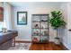 Comfortable home office space with wooden floors, stylish decor, and a plant at 5925 Old Bill Cook Rd, South Fulton, GA 30349