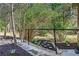 Landscaped garden with stone pathway, mulch, and flourishing plants, complemented by a black railing at 5925 Old Bill Cook Rd, South Fulton, GA 30349