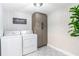 Well-equipped laundry room with modern appliances, ample storage, and patterned flooring at 5925 Old Bill Cook Rd, South Fulton, GA 30349