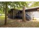 Back porch with steps, lattice and screening with an outdoor entrance at 633 Iris Rd, Pine Lake, GA 30072