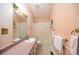 Bathroom features a shower-tub combination, vanity and large mirror at 633 Iris Rd, Pine Lake, GA 30072