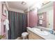 Bathroom with a shower, vanity, and framed mirror at 633 Iris Rd, Pine Lake, GA 30072