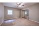 Bedroom with mirrored closets, neutral walls, and carpet floors at 633 Iris Rd, Pine Lake, GA 30072