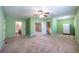 Bedroom featuring carpet floors, ceiling fan, and en suite bathroom at 633 Iris Rd, Pine Lake, GA 30072
