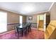 The dining room features a decorative chair rail and a table that seats six at 633 Iris Rd, Pine Lake, GA 30072
