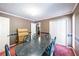 The dining room includes a table that seats six and has plenty of storage space at 633 Iris Rd, Pine Lake, GA 30072