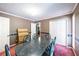 Traditional dining room with a dark table, six chairs, and a double door closet at 633 Iris Rd, Pine Lake, GA 30072