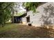 Side of the house with the back porch attached, plus an exterior door to basement at 633 Iris Rd, Pine Lake, GA 30072
