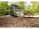 Home's exterior with an upper level exit from the two-car garage at 633 Iris Rd, Pine Lake, GA 30072