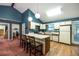 Kitchen with a kitchen island, appliances and hardwood floors at 633 Iris Rd, Pine Lake, GA 30072