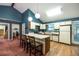 Kitchen area with eat in bar and hardwood flooring at 633 Iris Rd, Pine Lake, GA 30072
