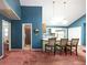 Open concept living and kitchen area with attached bar at 633 Iris Rd, Pine Lake, GA 30072