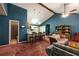 Open living room with a vaulted ceiling, ceiling fan and breakfast bar at 633 Iris Rd, Pine Lake, GA 30072