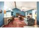 Cozy living room featuring a fireplace, vaulted ceiling, and open floor plan at 633 Iris Rd, Pine Lake, GA 30072