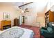 Spacious main bedroom with adjacent bathroom, dresser, vaulted ceilings and bookshelf at 633 Iris Rd, Pine Lake, GA 30072