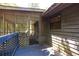 Outdoor screened in porch with access to deck and surrounding woods at 633 Iris Rd, Pine Lake, GA 30072