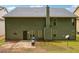 Exterior shot of the backyard shows the patio and grassy lawn area at 9744 Musket Ridge Cir, Jonesboro, GA 30238