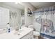 Neutral bathroom showcasing a vanity, toilet, and an elephant-themed shower curtain at 9744 Musket Ridge Cir, Jonesboro, GA 30238
