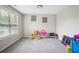 Bright bedroom features natural light, neutral paint, and plush carpeting at 9744 Musket Ridge Cir, Jonesboro, GA 30238