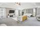 Spacious main bedroom with a sitting area, a bed, and French doors leading to another room at 9744 Musket Ridge Cir, Jonesboro, GA 30238