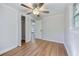 Bright bedroom with hardwood floors, a ceiling fan, and access to a closet and bathroom at 1786 Richard Ne Rd, Conyers, GA 30012