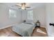 Serene bedroom with hardwood floors, neutral paint, and natural lighting at 1786 Richard Ne Rd, Conyers, GA 30012