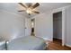 Bedroom featuring hardwood floors, a ceiling fan, and access to a closet and bathroom at 1786 Richard Ne Rd, Conyers, GA 30012